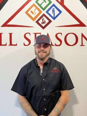 All Seasons Roofing & Restoration employee.